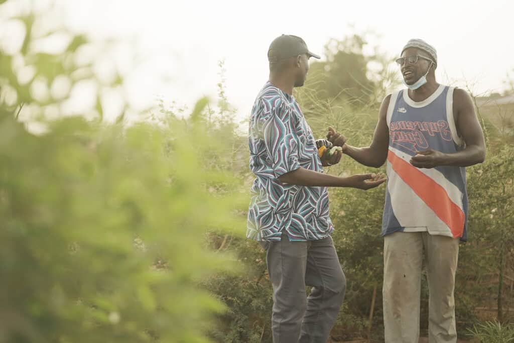 adf trees staff member and farmer speaking