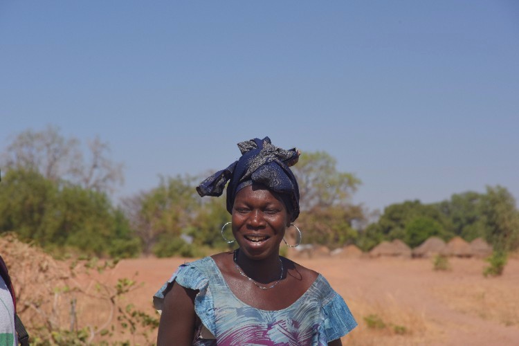 Ndeye standing in a field