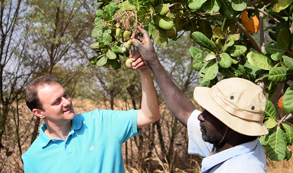 Ousmane with Trees for the Future member