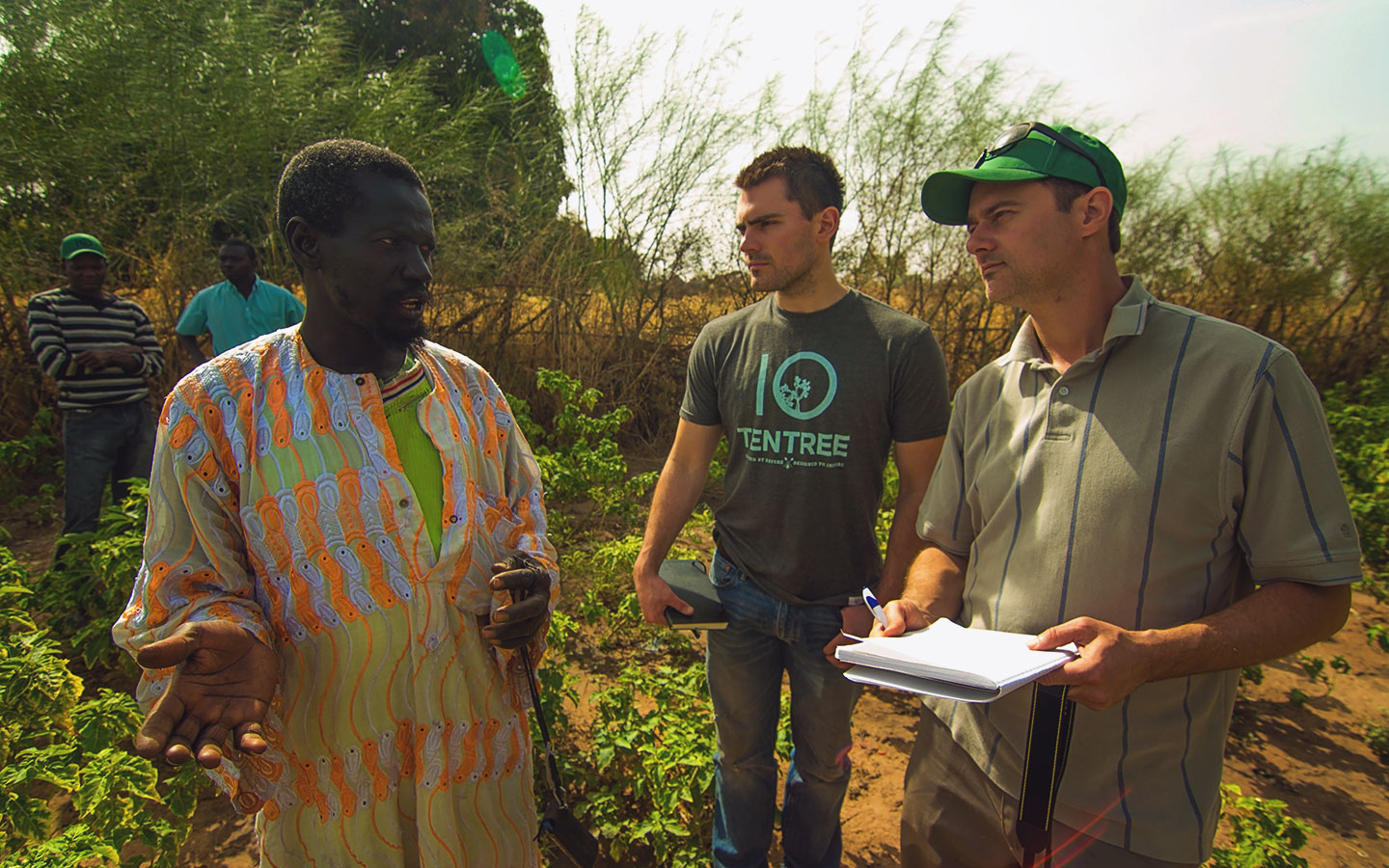 Mate Mbaye with Trees for the Future staff