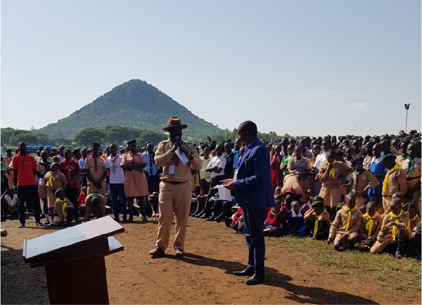 Trees for the Future representative addressing a large gathering of Kenyan Scouts during a tree planting organization event